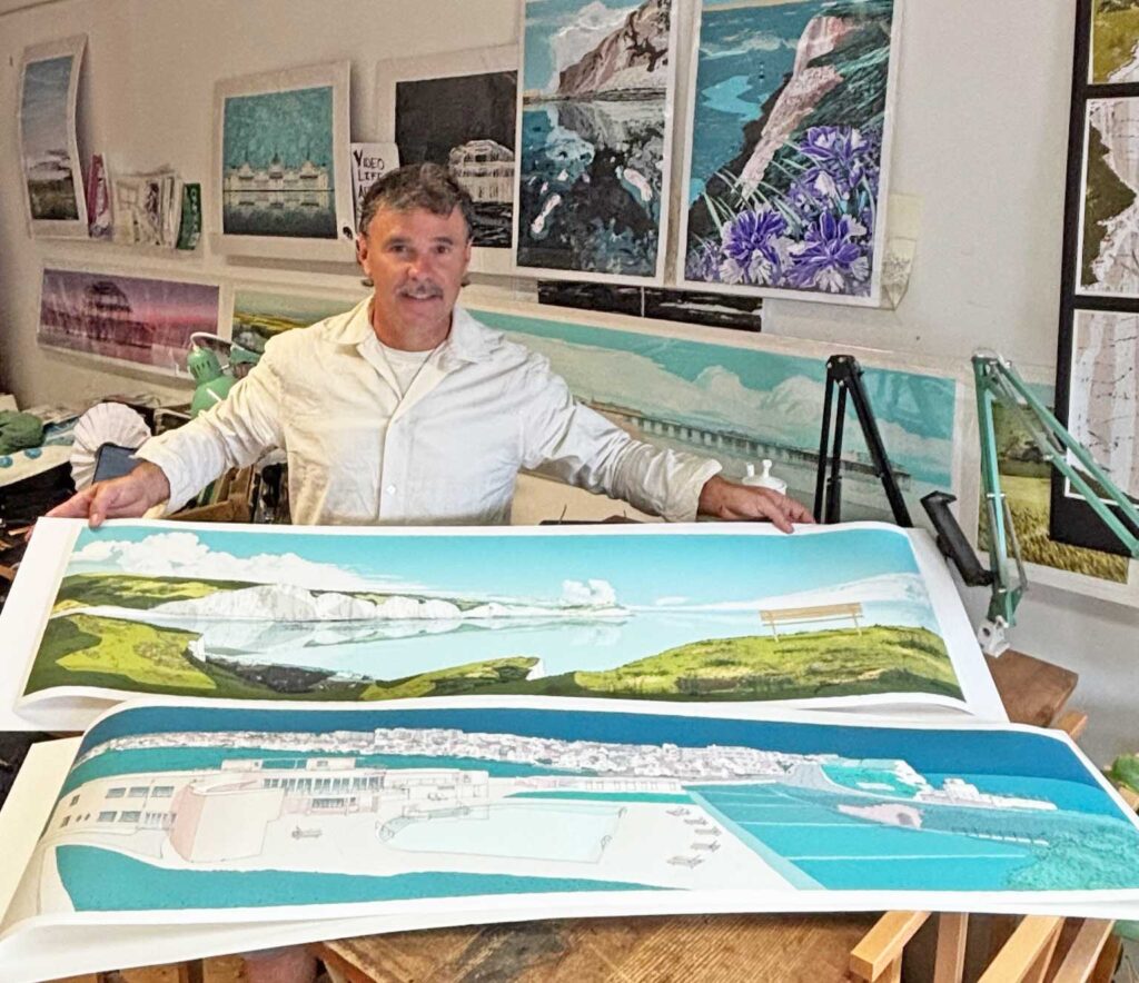 artists alej ez at his studio in Brighton UK showing two panorama limited edition prints July 2026
